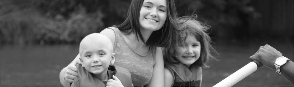 Image of Mom with Two Girls on a Rowboat