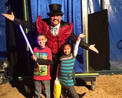 Image of Two Children with a Magician